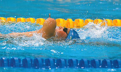 Christoffer Lindhe swimming in a pool.